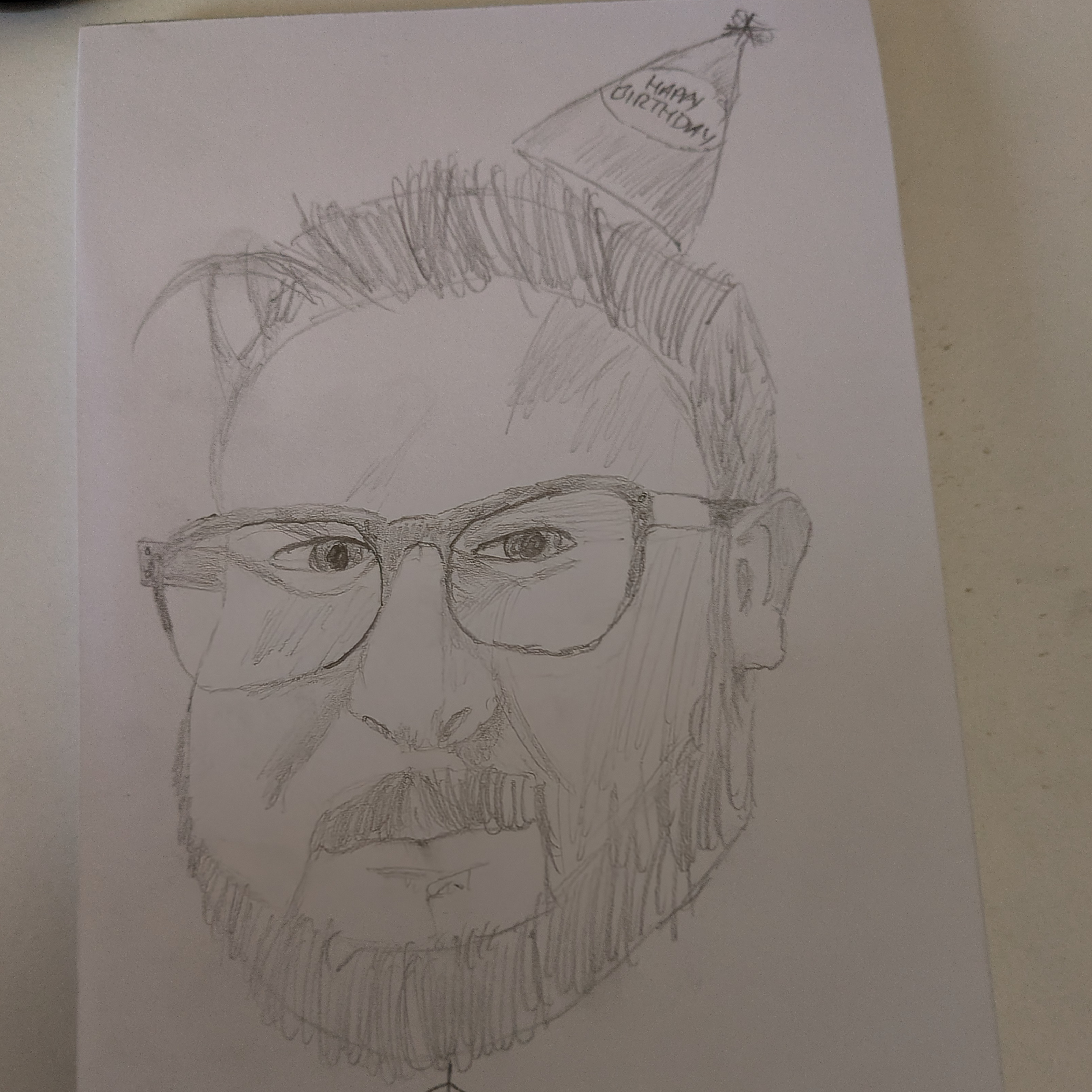 An amateurish drawing of Carson Winter with a little birthday hat